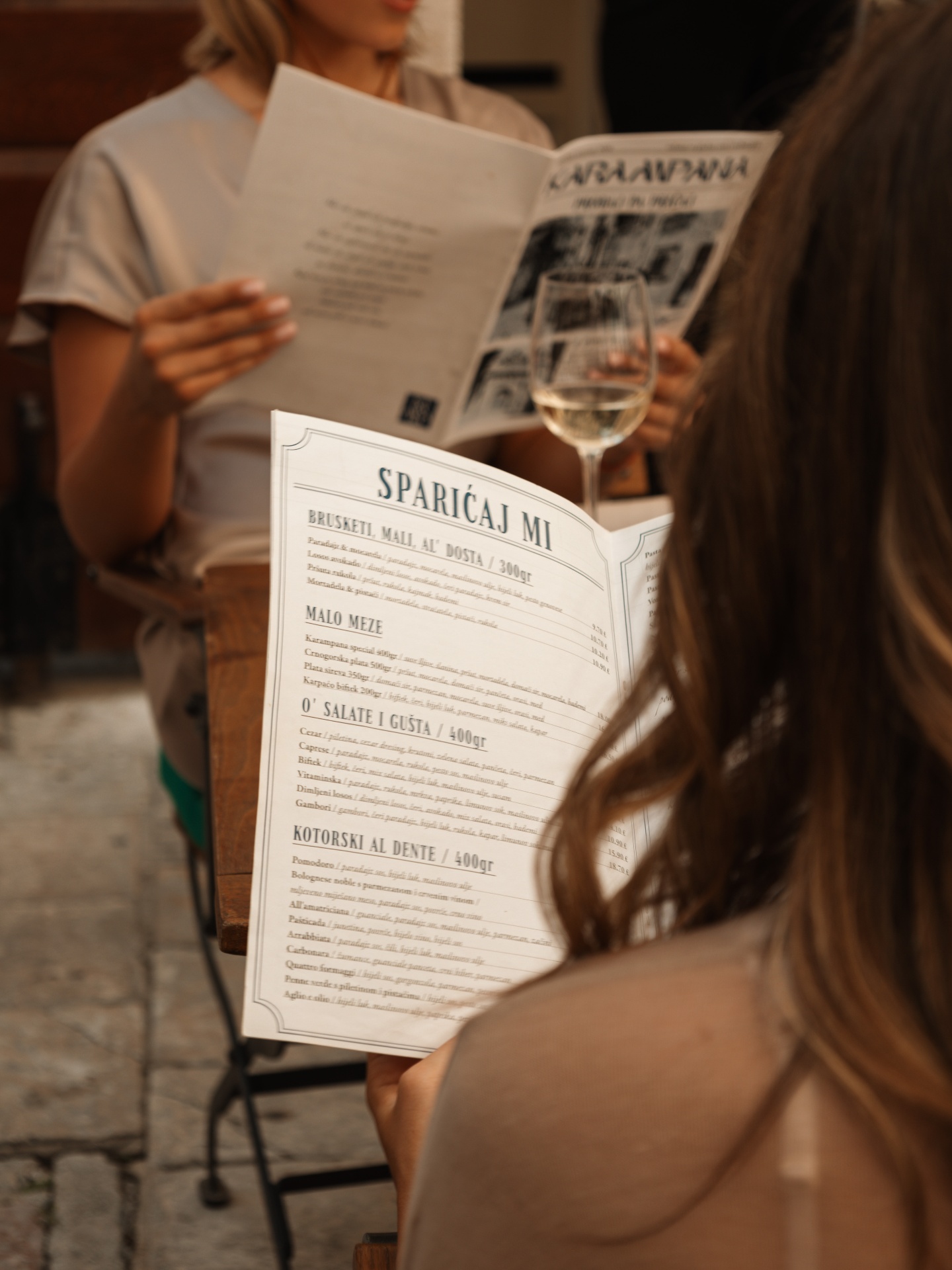 Guests reading the Karampana menu