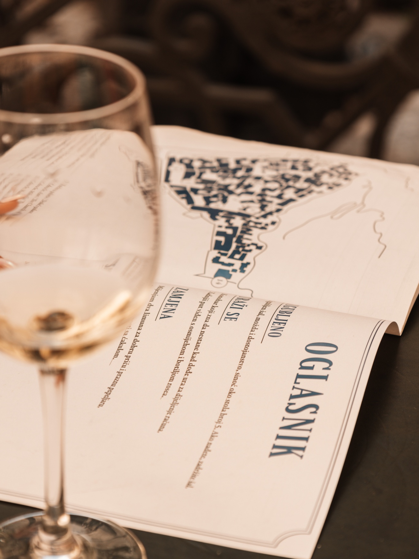House menu and a glass of wine